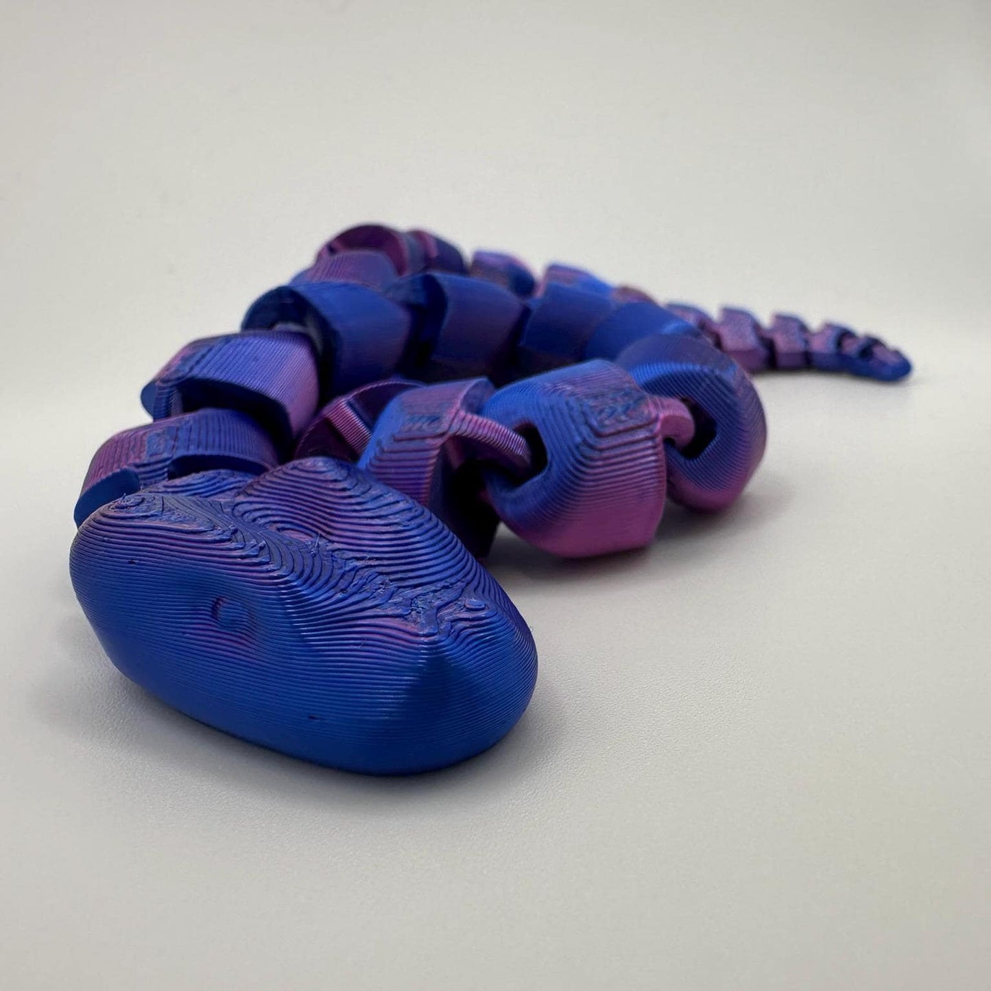 π Articulated 3D Fidget Snake - 34cm Long Neon Blue/Magenta Colour
